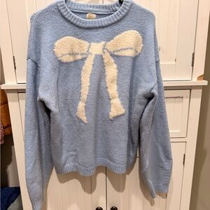 Light Blue Sweater with Cream Bow